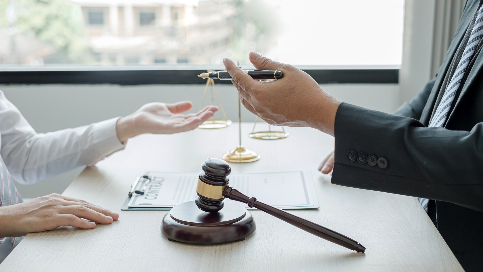 lawyer or a judge counseling clients about judicial justice and prosecution with scales,